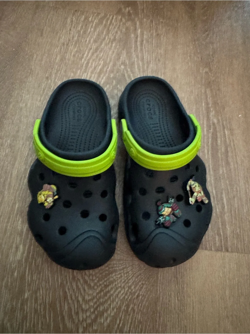CROCS Kids Black Clogs with Lime Green Heel Strap